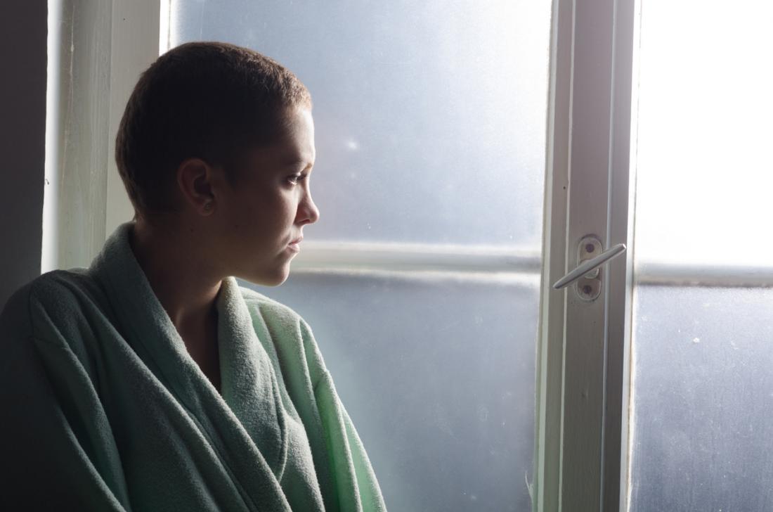 woman looking out the window