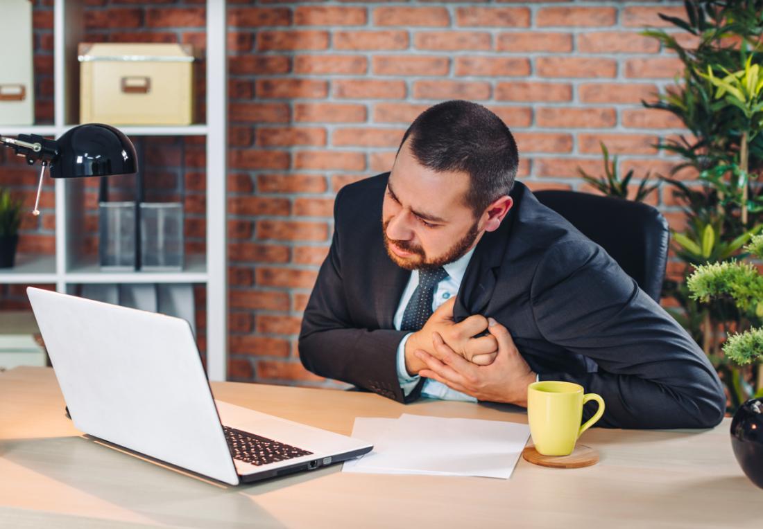 Man feels heartache suffering from cardio ailments and clutching