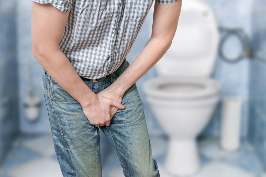 Man experiencing painful urination because of a prostate problem.