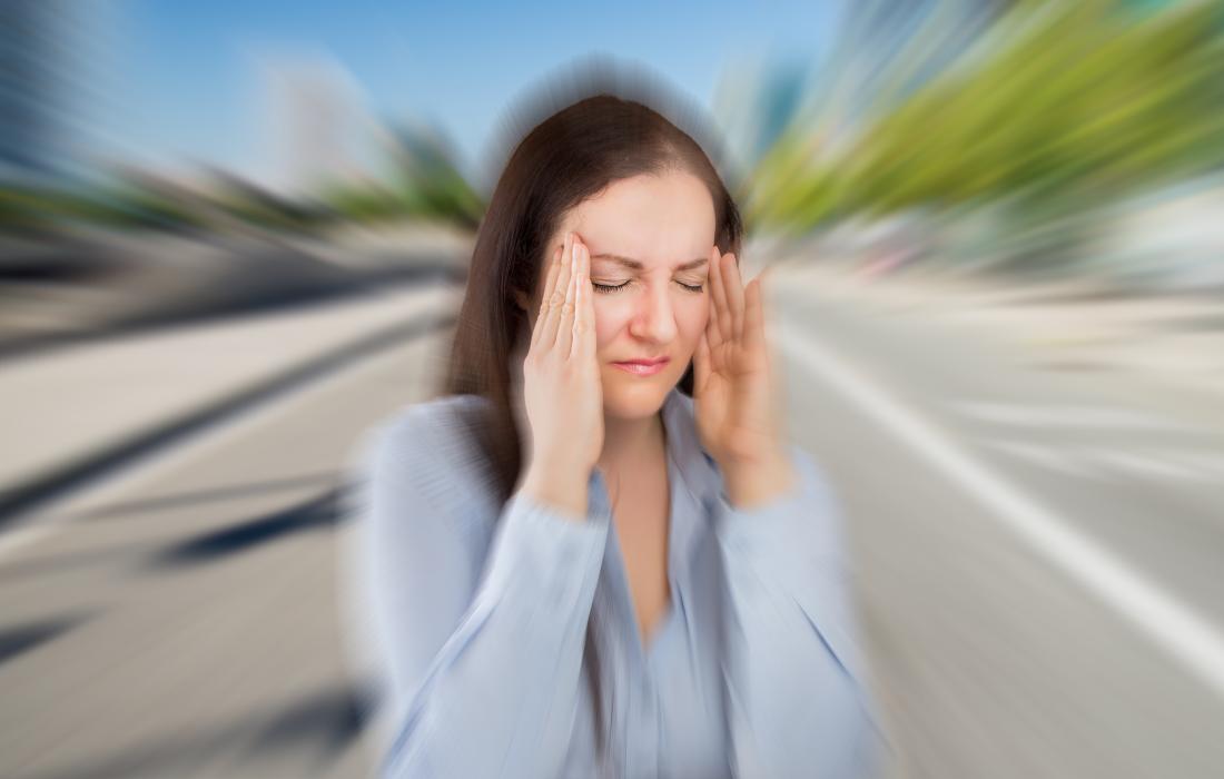 a woman experiencing a migraine