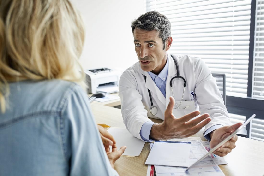woman speaking with a doctor