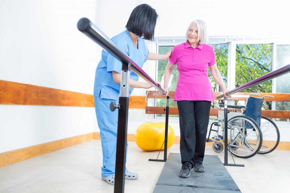 Senior lady working with physical therapist
