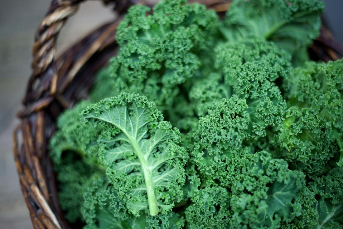 Kale in basket, contains vitamin K.
