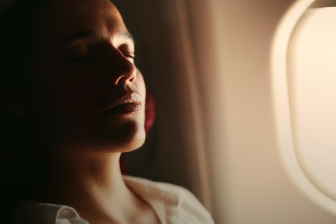 woman relaxing on plane