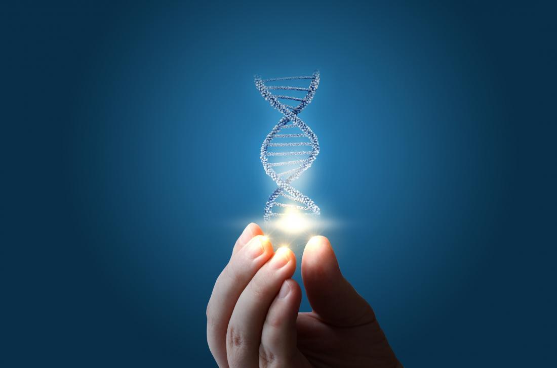 a woman holding a strand of DNA