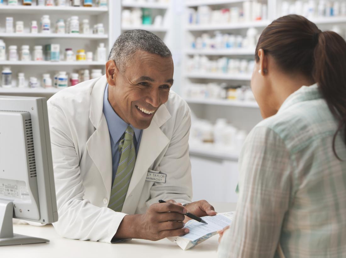 Pharmacist in discussion with a customer