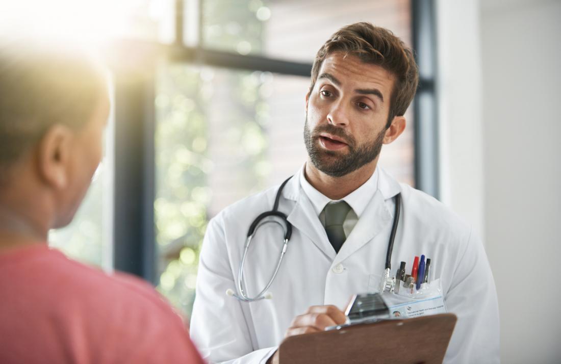 male doctor speaking to male patient