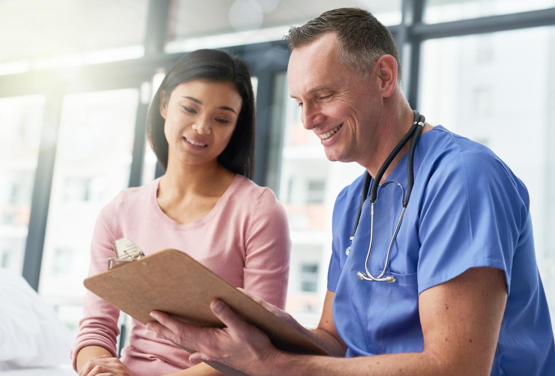 Doctor and patient together in hospital.