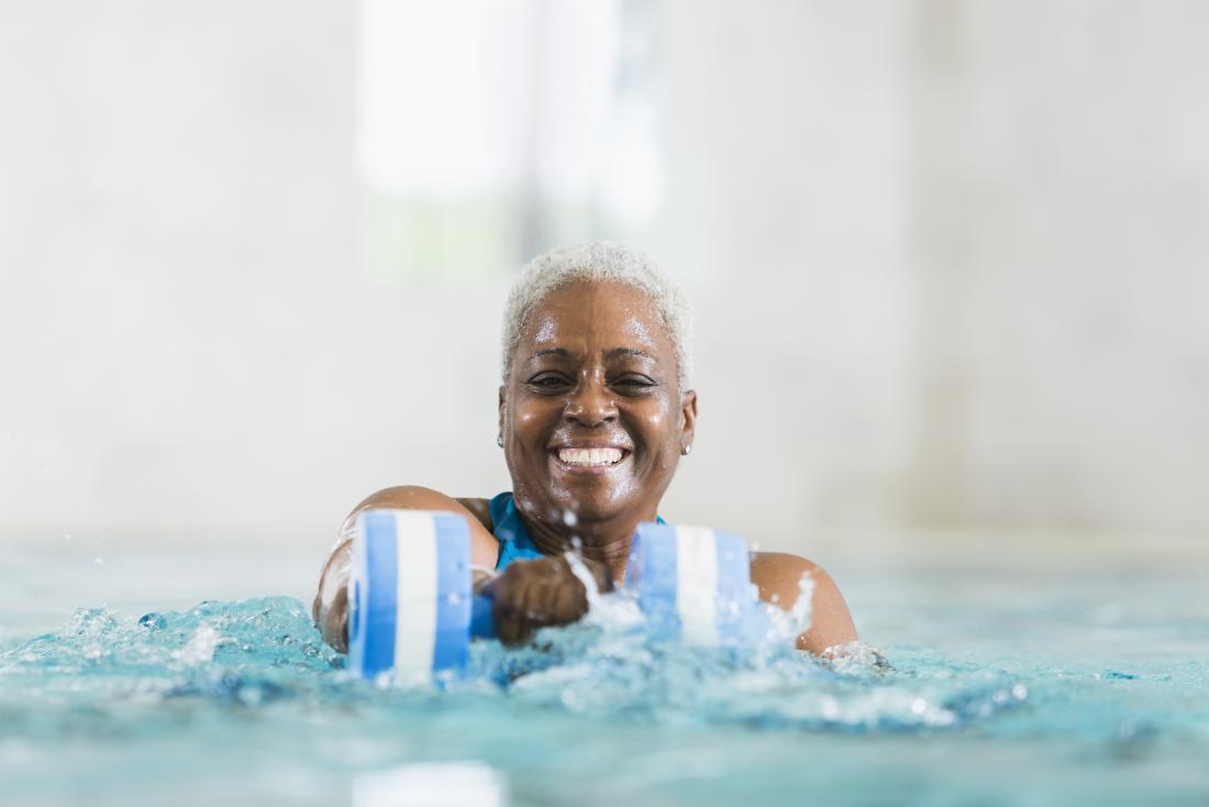 senior woman exercising in a pool