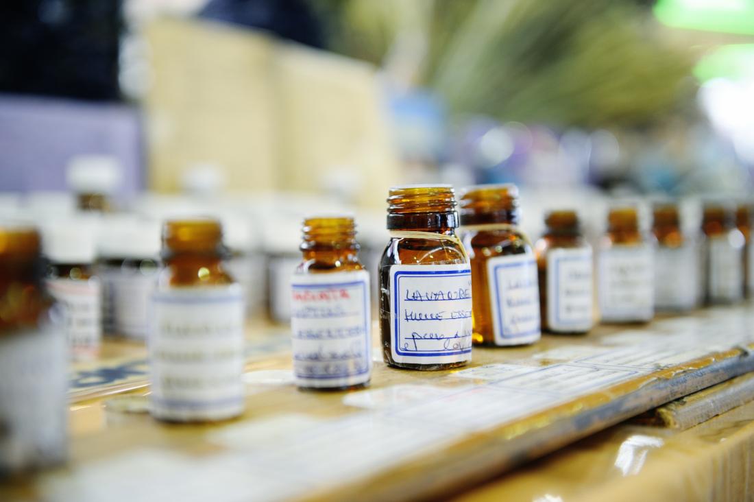 A row of different essential oil bottles lined up.