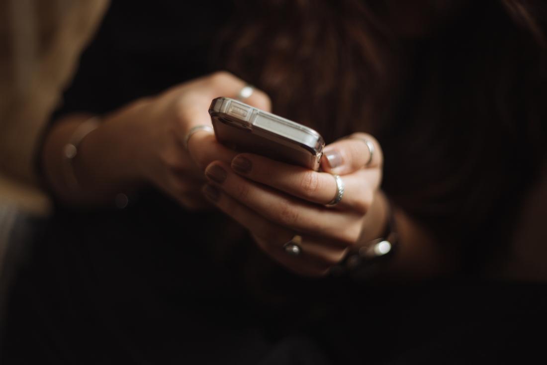 woman checking mobile phone