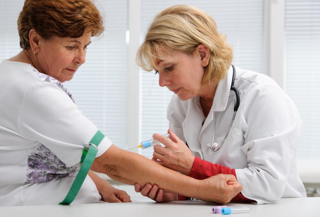 woman having blood drawn for test