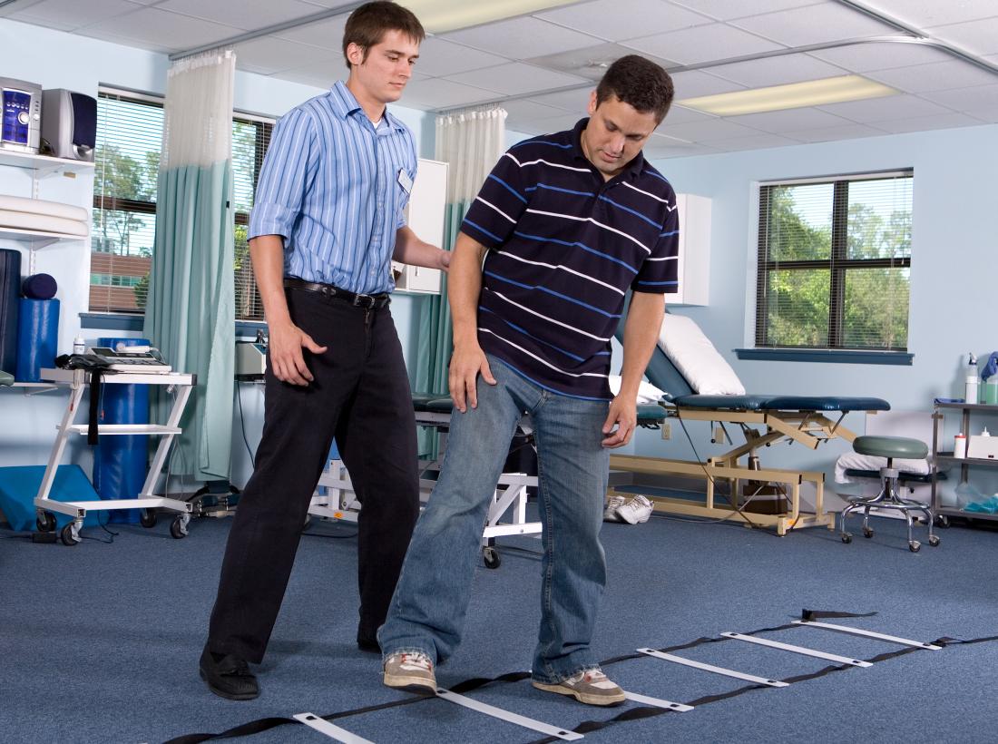 Person rehabilitating with physical therapy after experiencing anoxia.