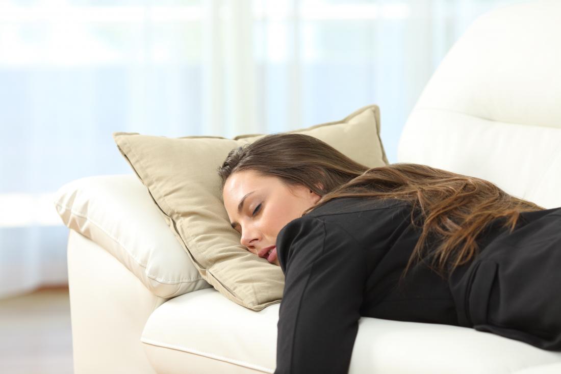 young woman asleep on the sofa