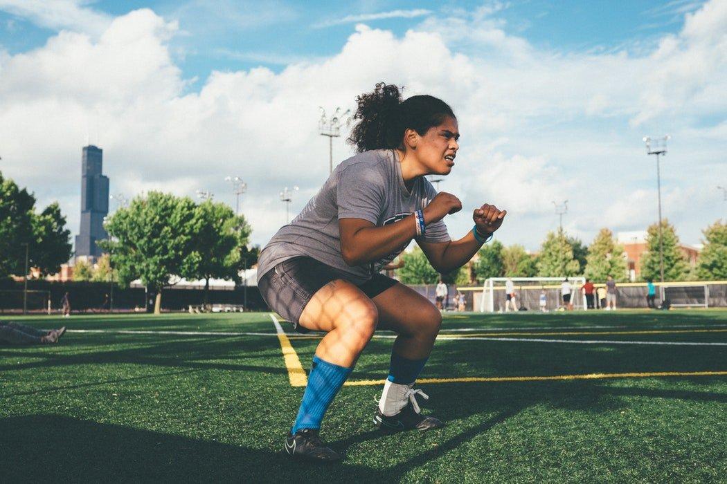 woman doing squats in high intensity exercise
