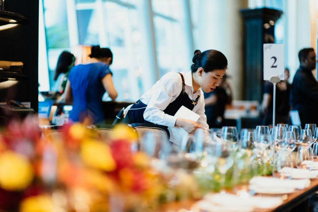 woman setting the table in a catering job