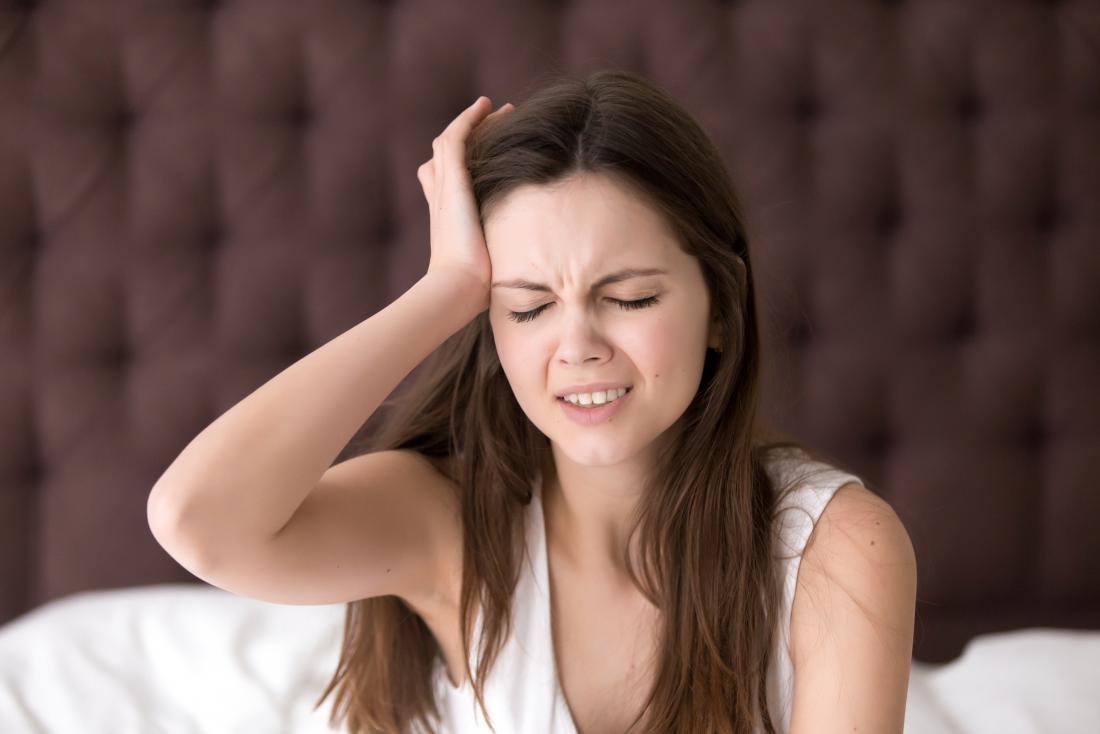 a woman with a migraine