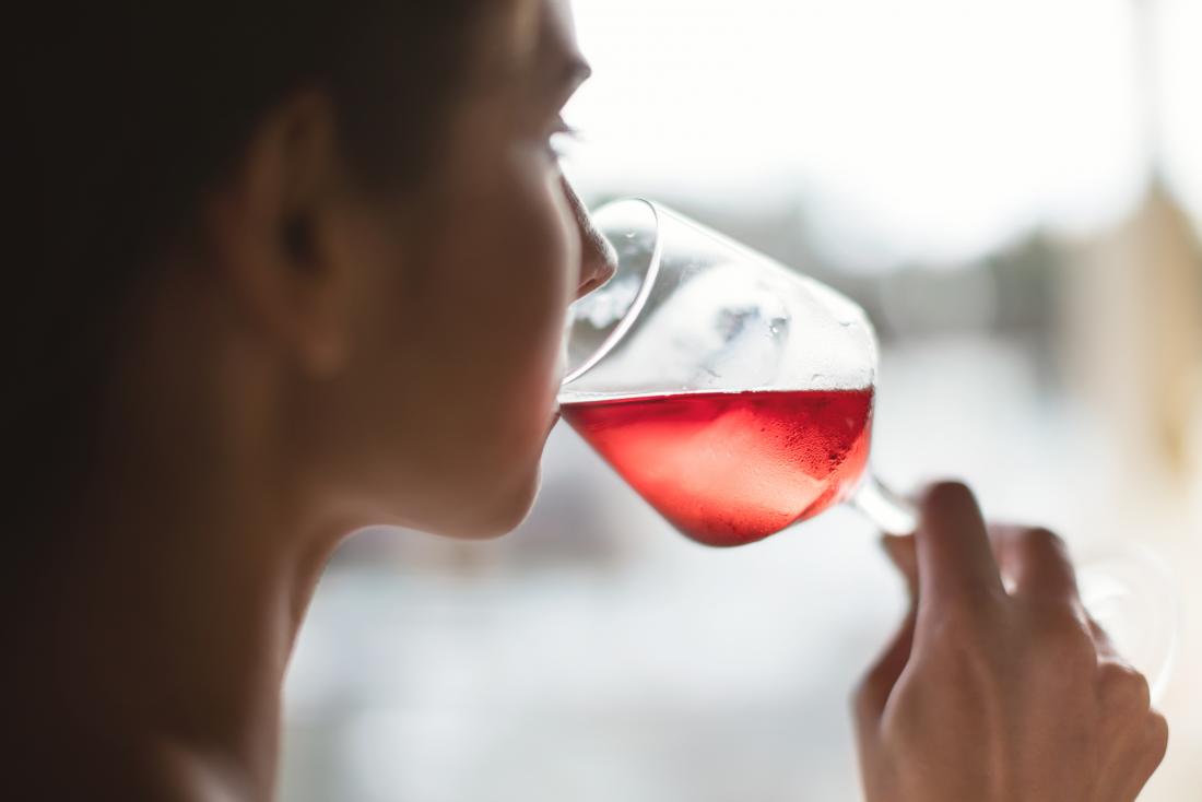 Woman drinking rose wine which may be linked to loose stools