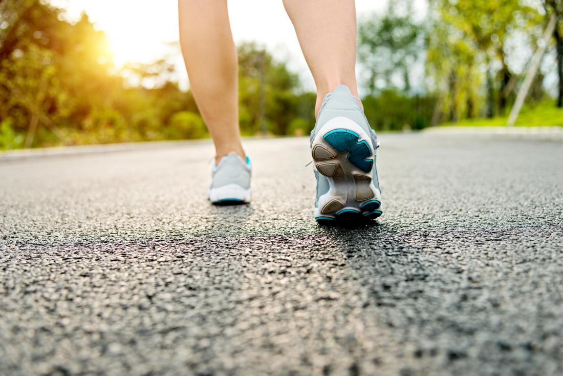 person running along a road