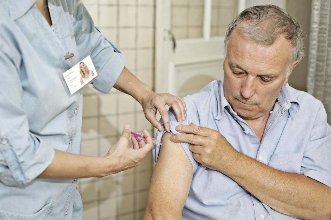 senior man receiving a vaccination