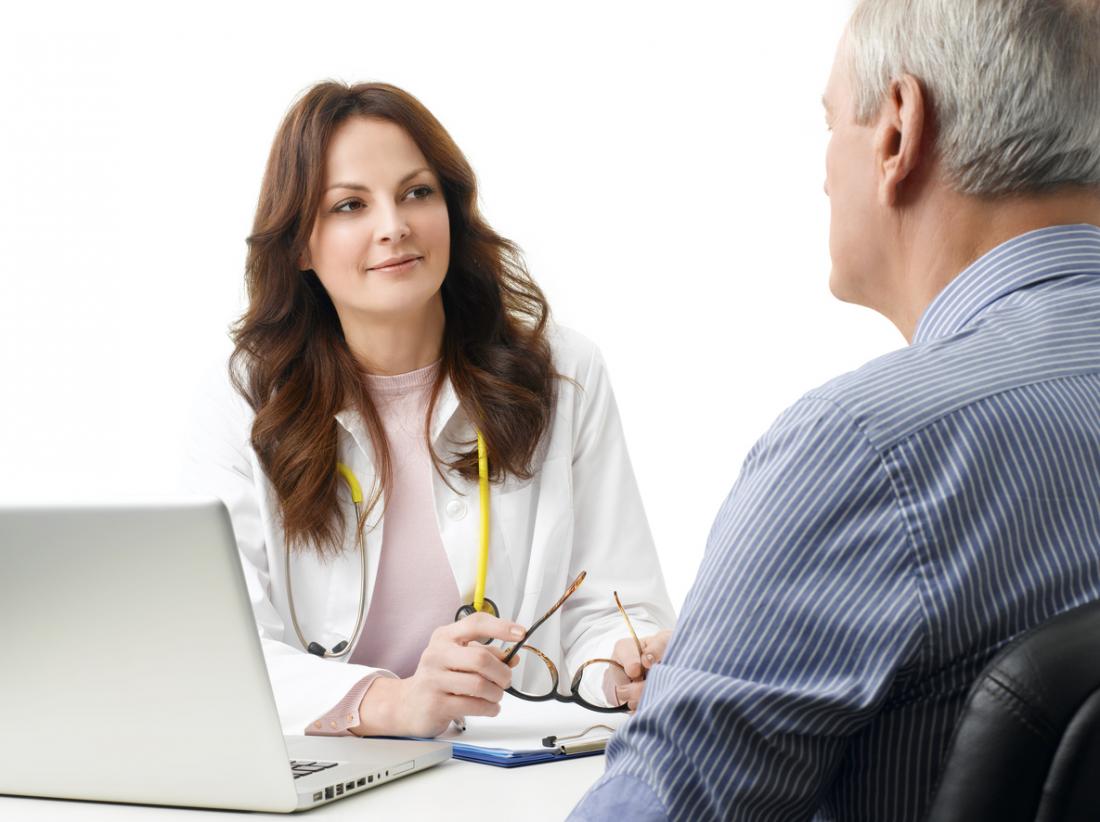 doctor consults with her patient