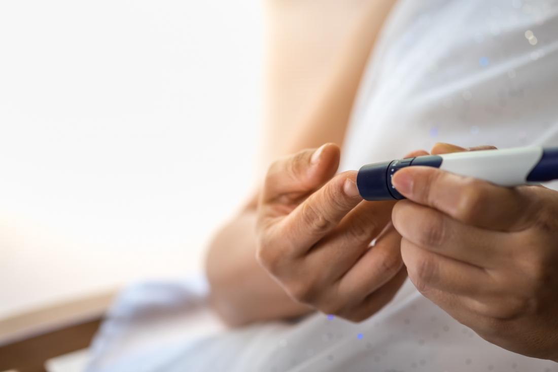 Woman testing glucose levels