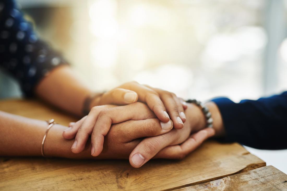 Hold my hand Touching may ease pain by syncing brainwaves