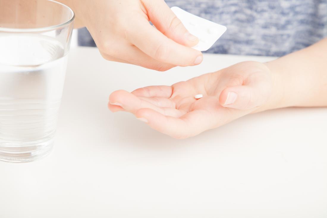small white pill in hand