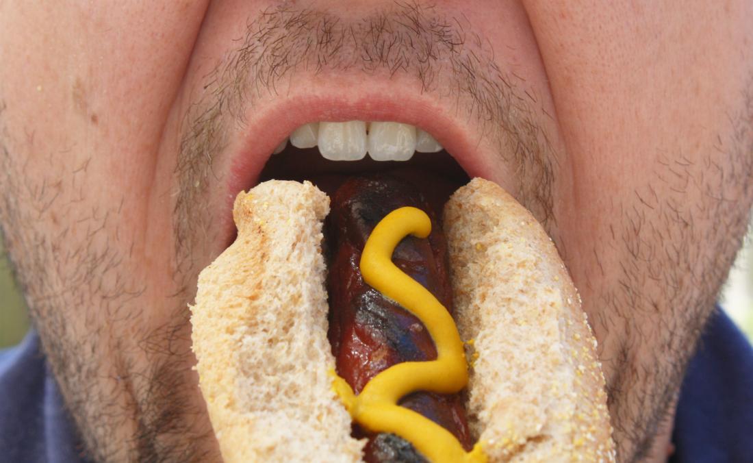 Man eating a hot dog