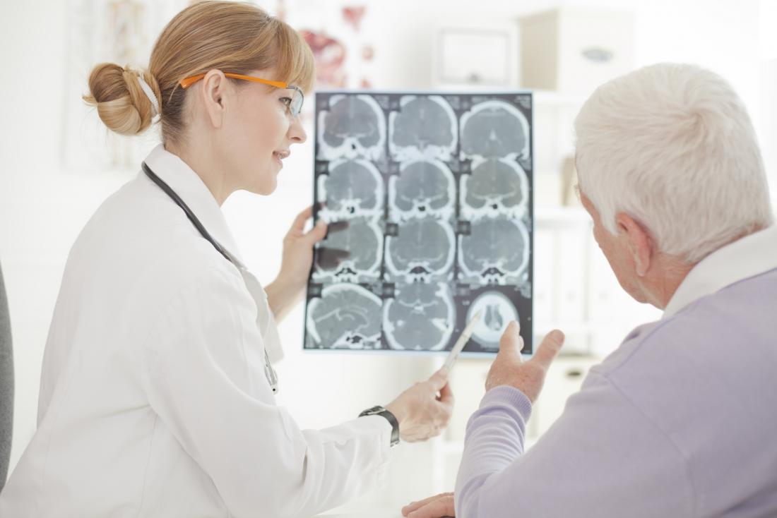 Older adult looking at brain scans