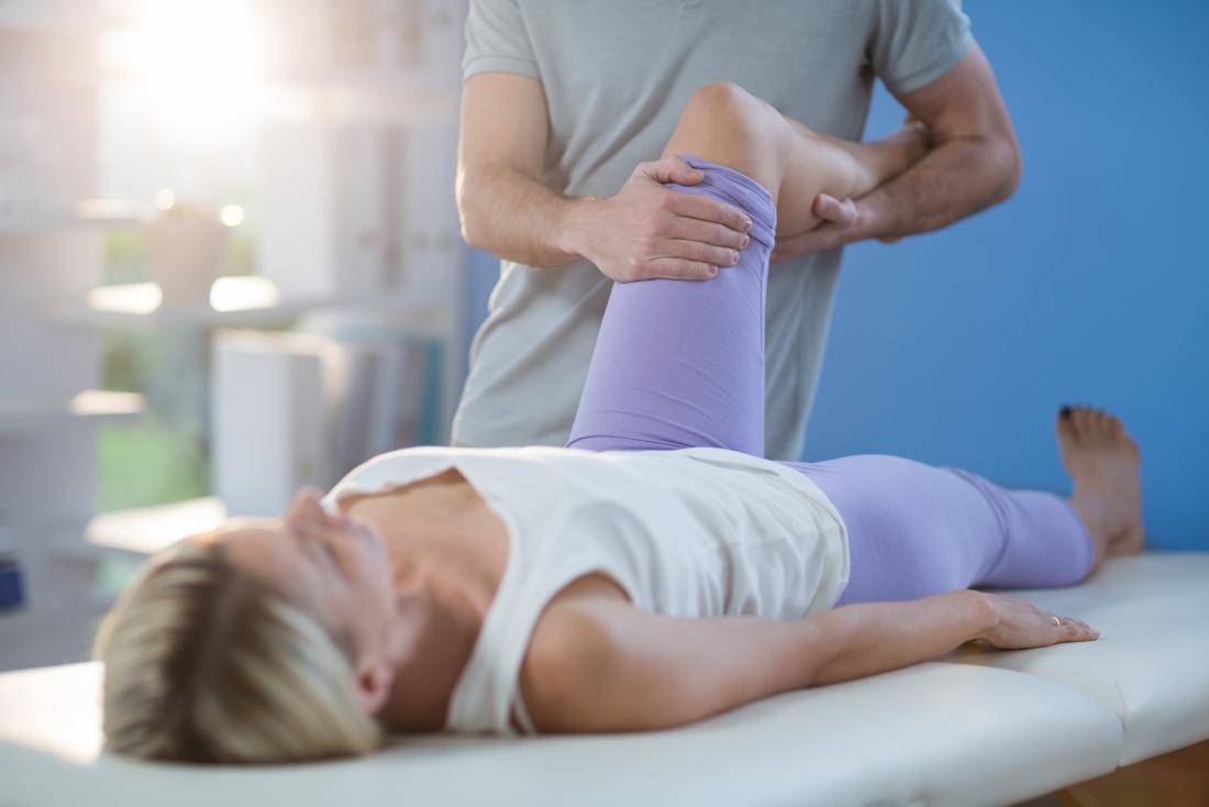 Lady having a leg massage due to numbness in the legs and feet