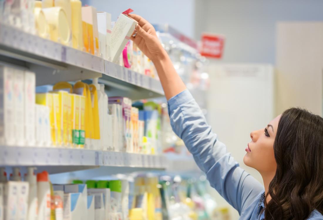 Woman shopping for cosmetic products.