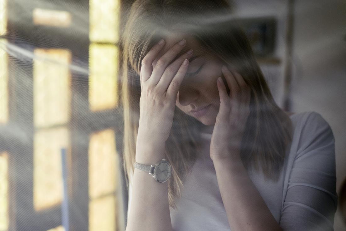 woman with headache and fatigue