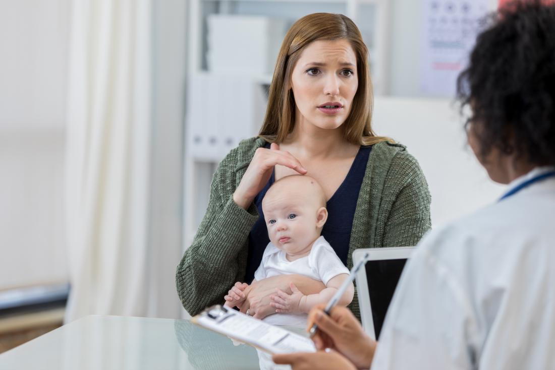 mother with small baby in doctors surgery