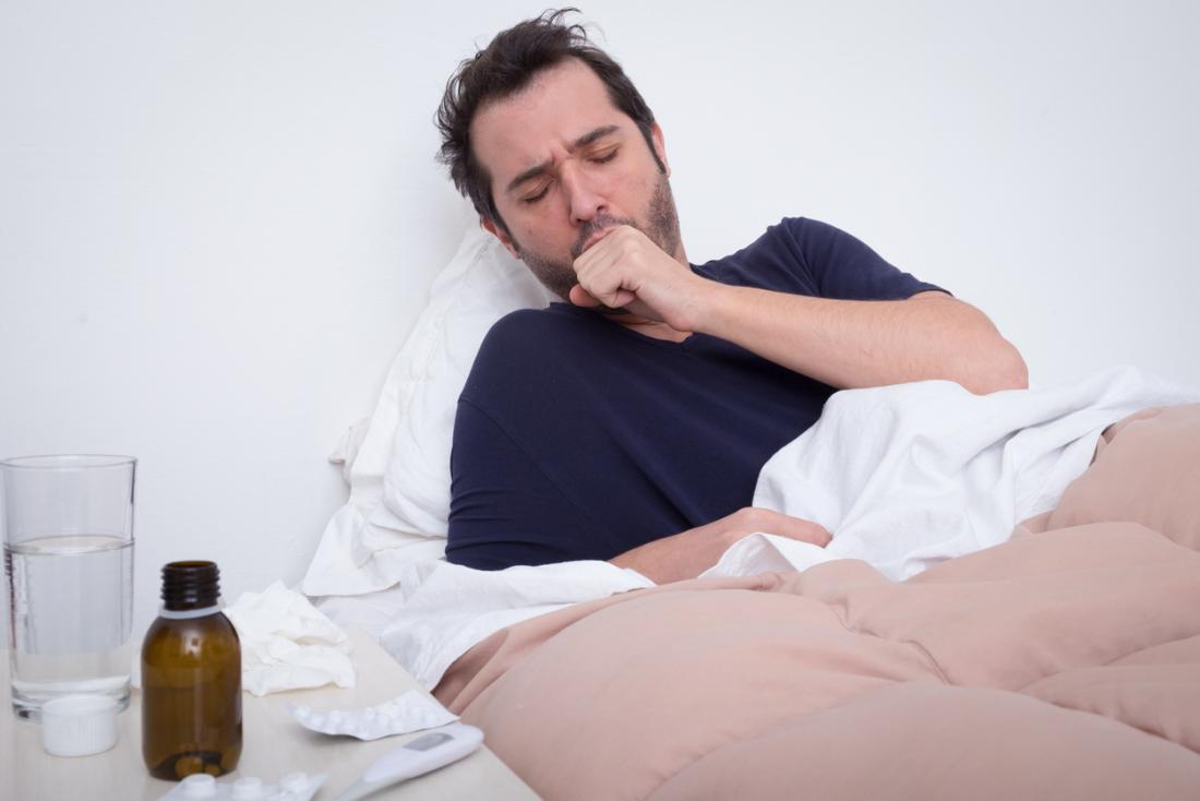 Man in bed with pneumonia