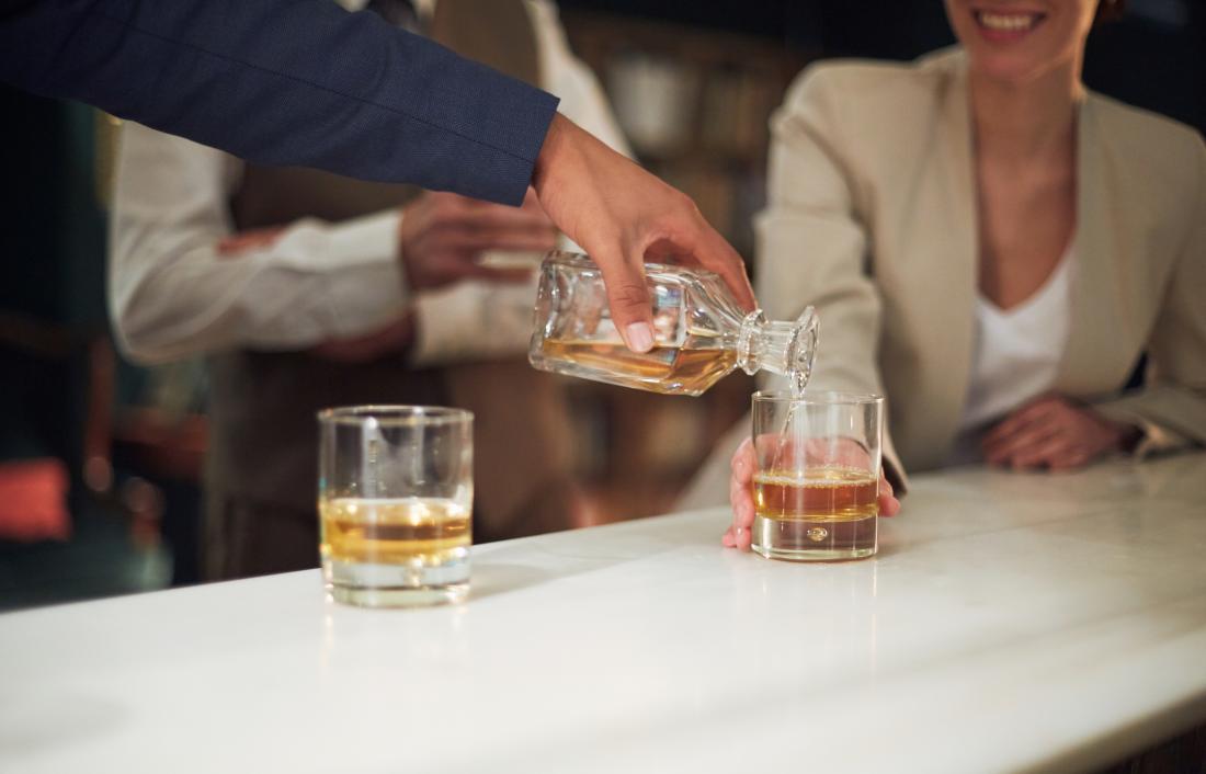 People drinking alcohol at a bar