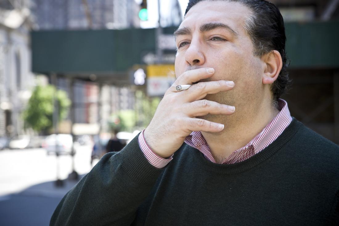 Middle aged man smoking cigarette