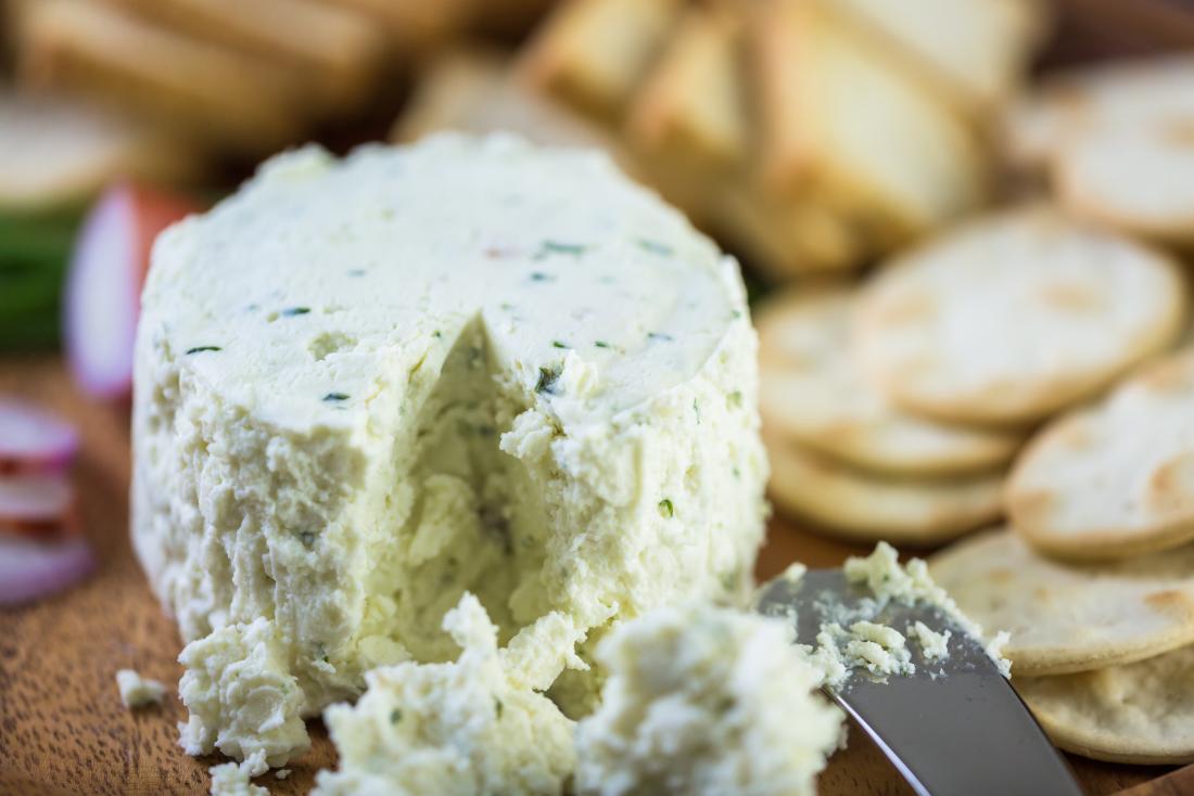 Soft creamy cheese amongst biscuits, crackers.