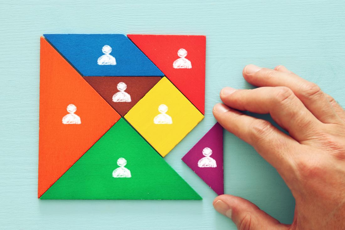 concept photo showing hand assembling puzzle pieces
