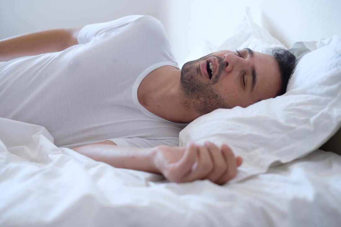man snoring with mouth open
