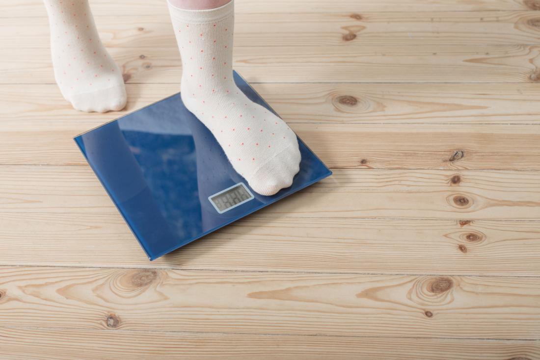 Child standing on weighing scales