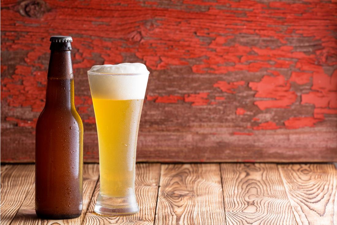 bottle and glass filled with beer