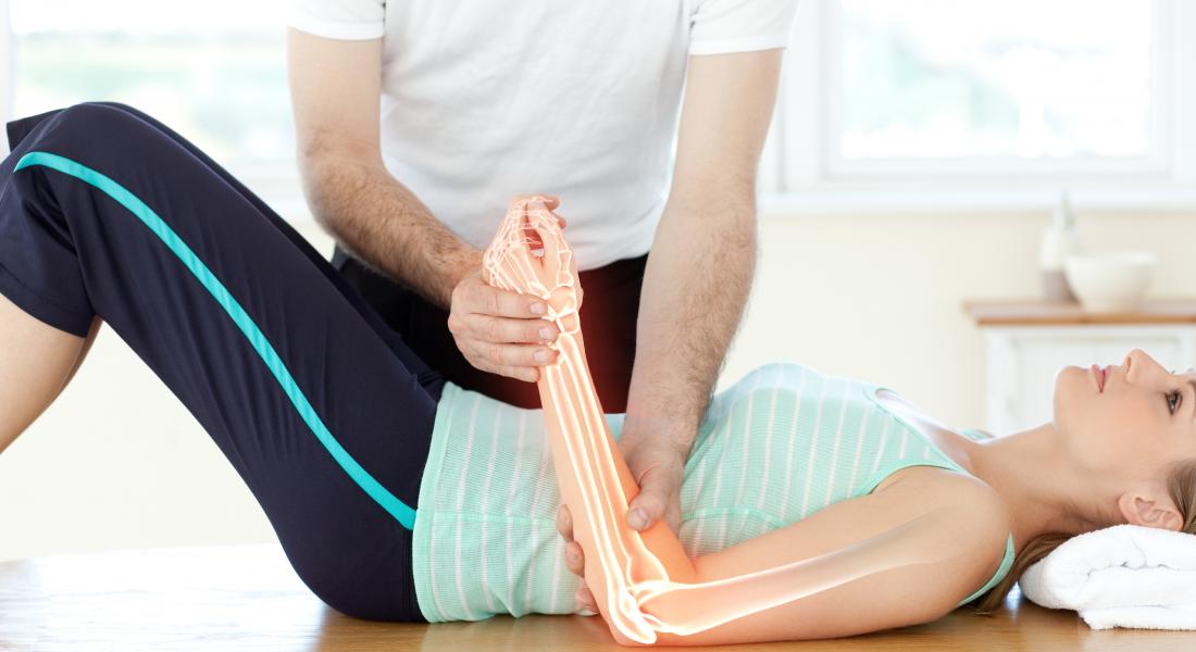 woman having physical therapy on arm