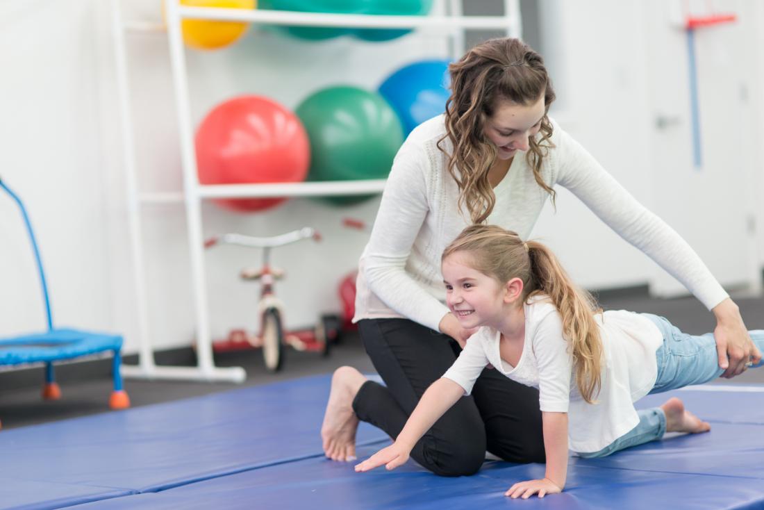 young girl having physical therapy