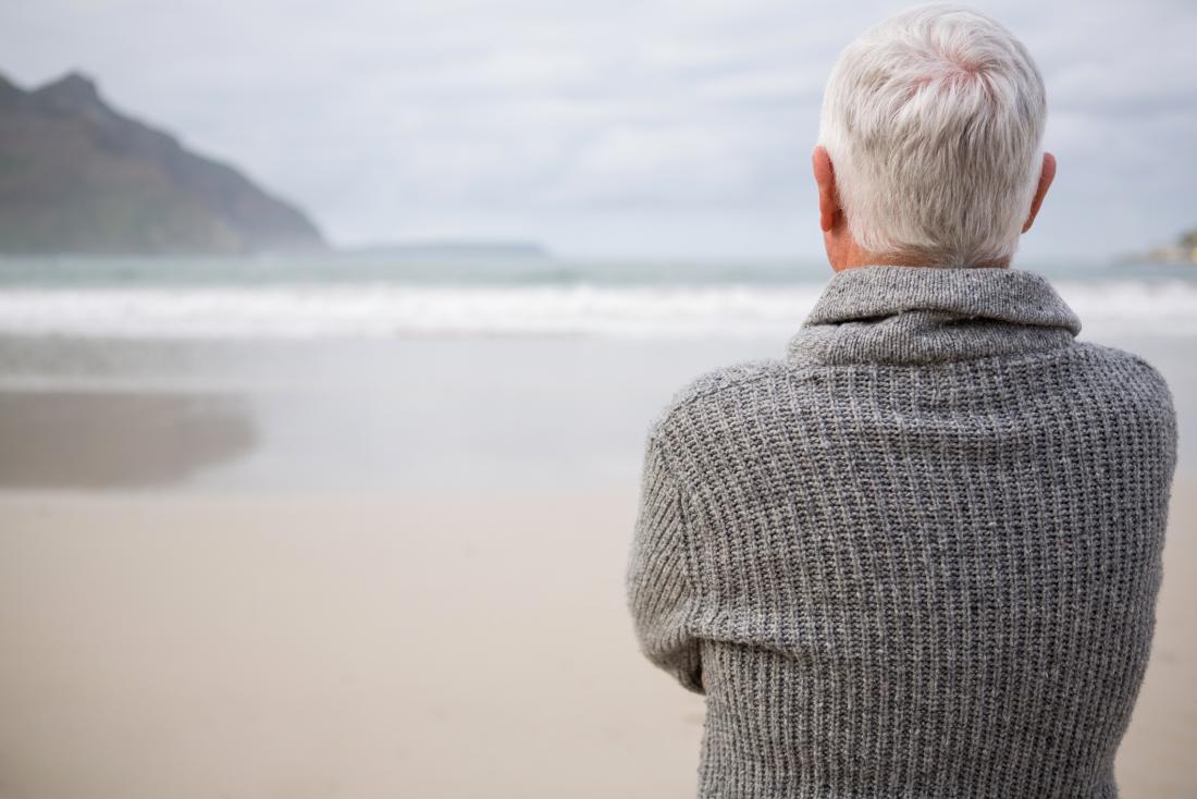 Older adult looking at the sea