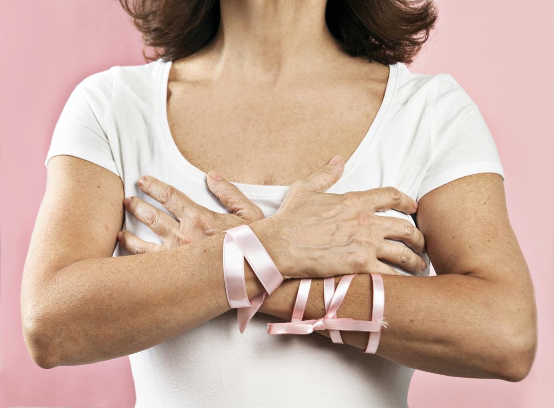 woman wearing breast cancer awareness ribbons