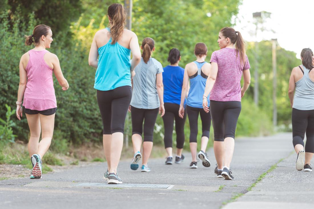 group of women brisk walking which is a stretch for runners