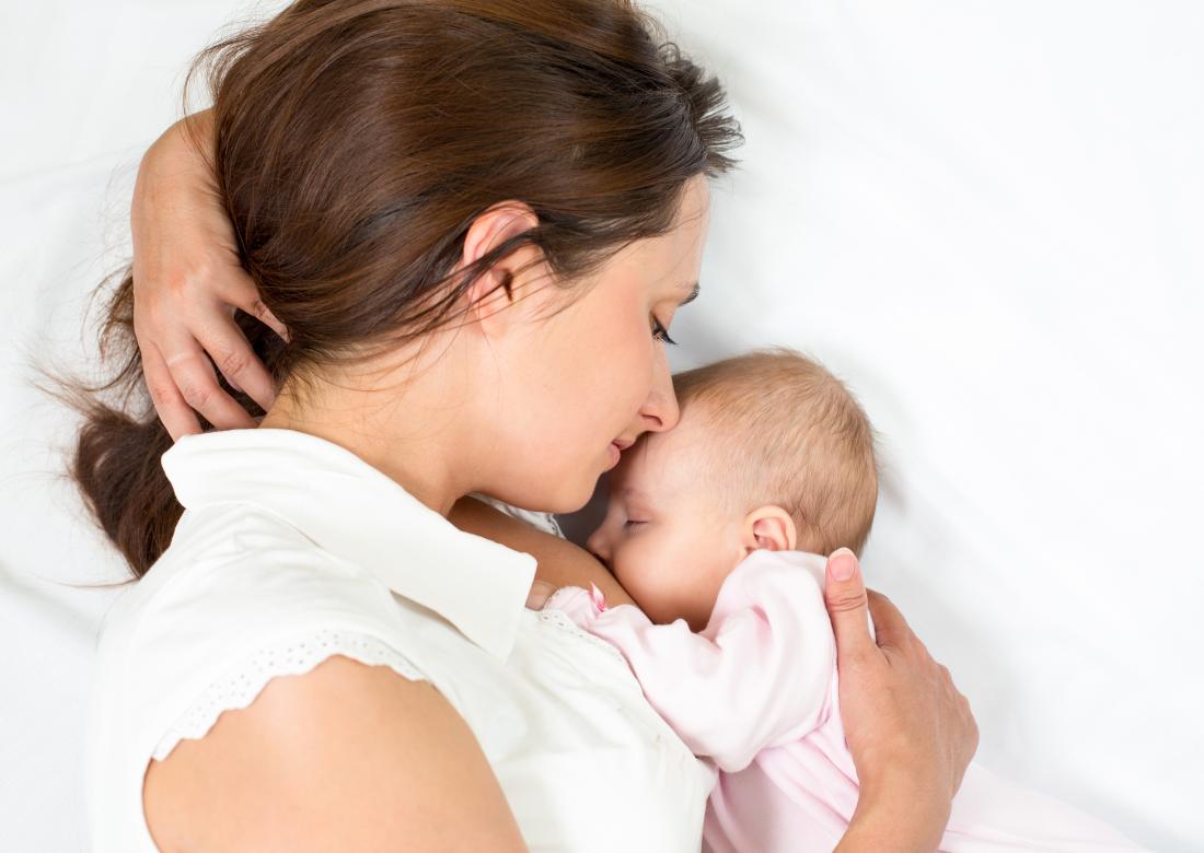 Mother feeding shop baby