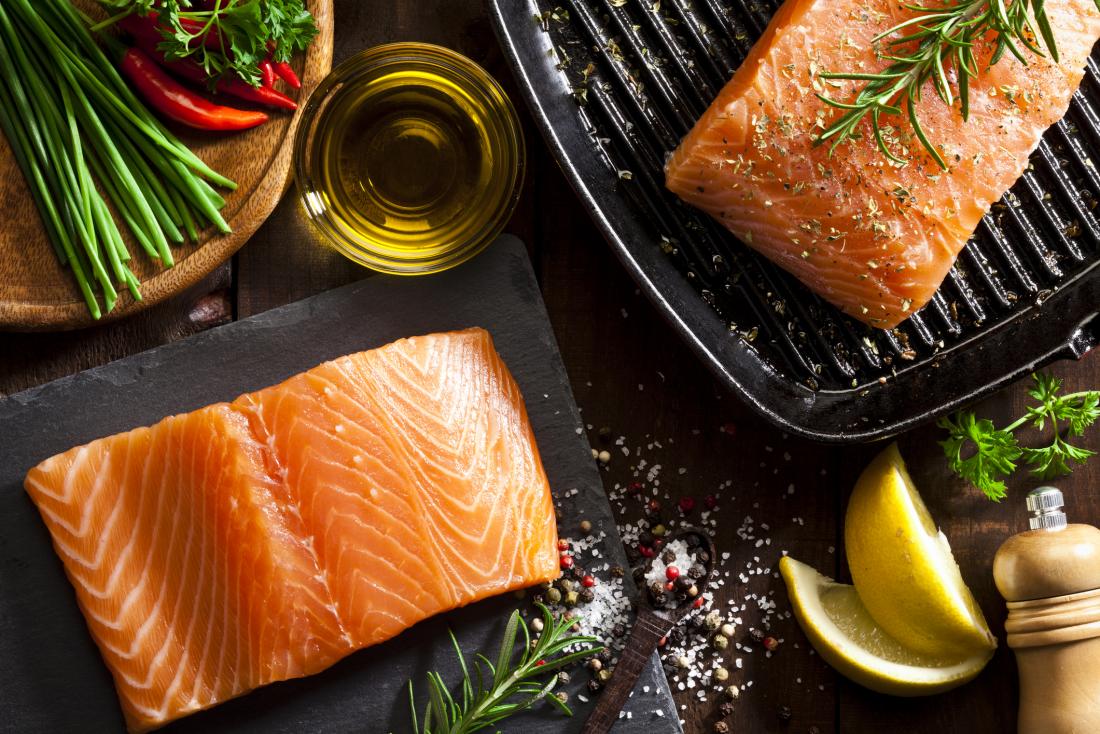 salmon on a board and griddle pan