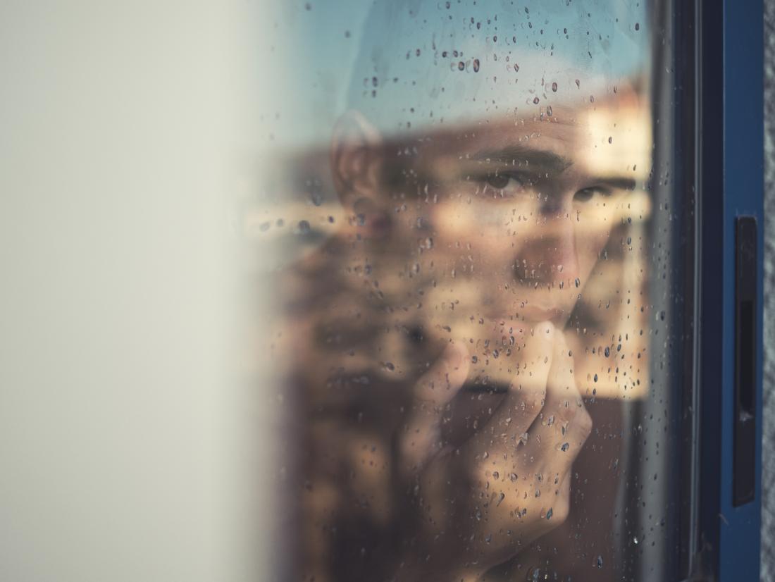 Anxious man in window